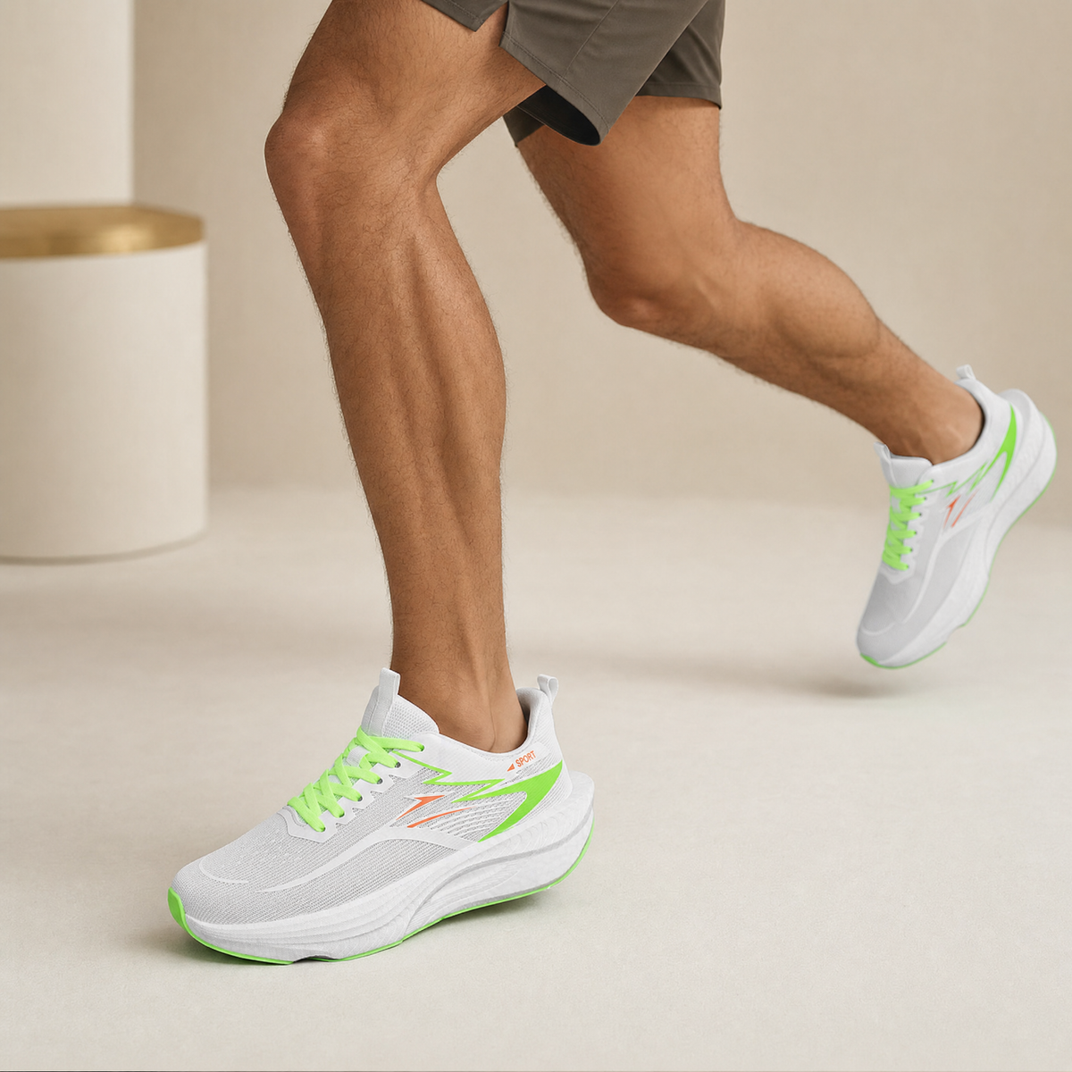 White Green air-cushion running shoe worn by a runner, cream studio backdrop