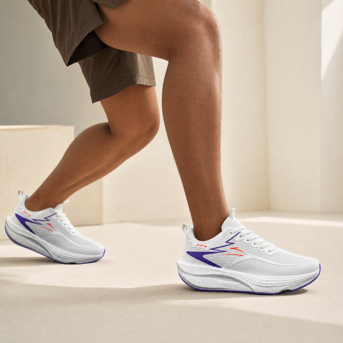 White Blue air-cushion running shoe worn by a runner, cream studio backdrop